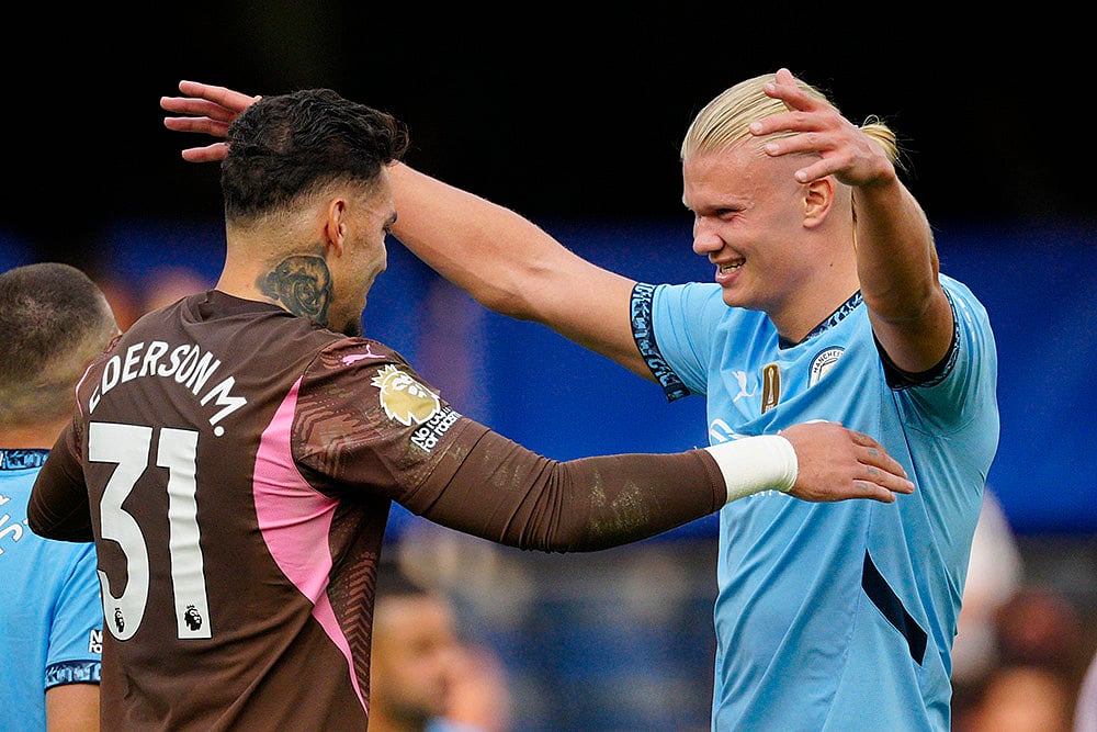 | Photo: AP/Dave Shopland : EPL 2024-25, Chelsea Vs Manchester City: Manchester City's goalkeeper Ederson and Erling Haaland celebrate their victory 